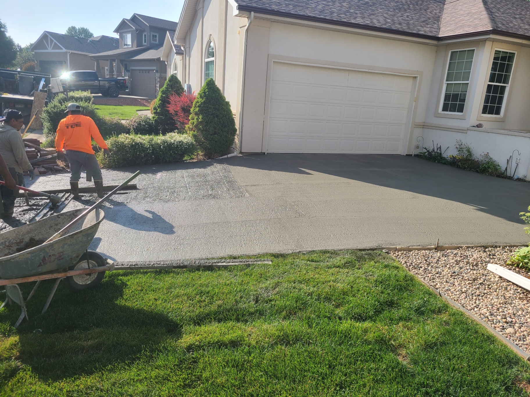 Smooth-finished concrete driveway at a single-family home